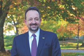 Thomas L. Hellie, president