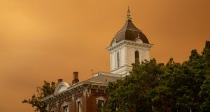 Smoke tainted sky over Linfield's Pioneer Hall