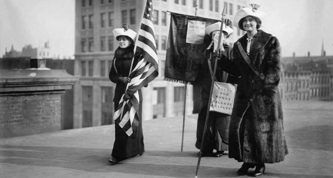 Suffragettes with flag