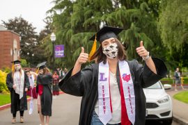 2020 Graduate celebrating in mask