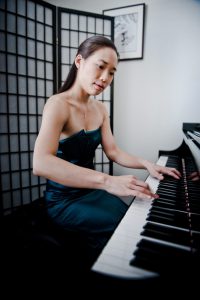 Monica Ohuchi playing on piano