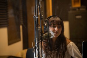Nathaly Sanchez in the podcast studio