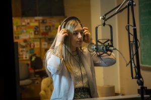 Kendall Harrison in podcast studio