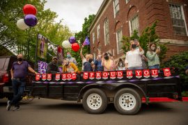 A trailer full of family celebrate graduates