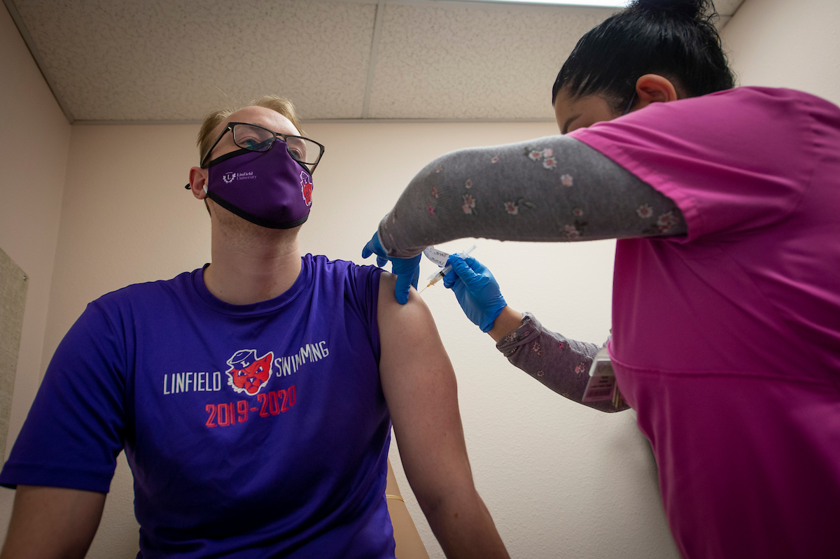 student receives COVID-19 vaccine