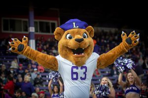 Mascot Mack cheers on crowd at football game