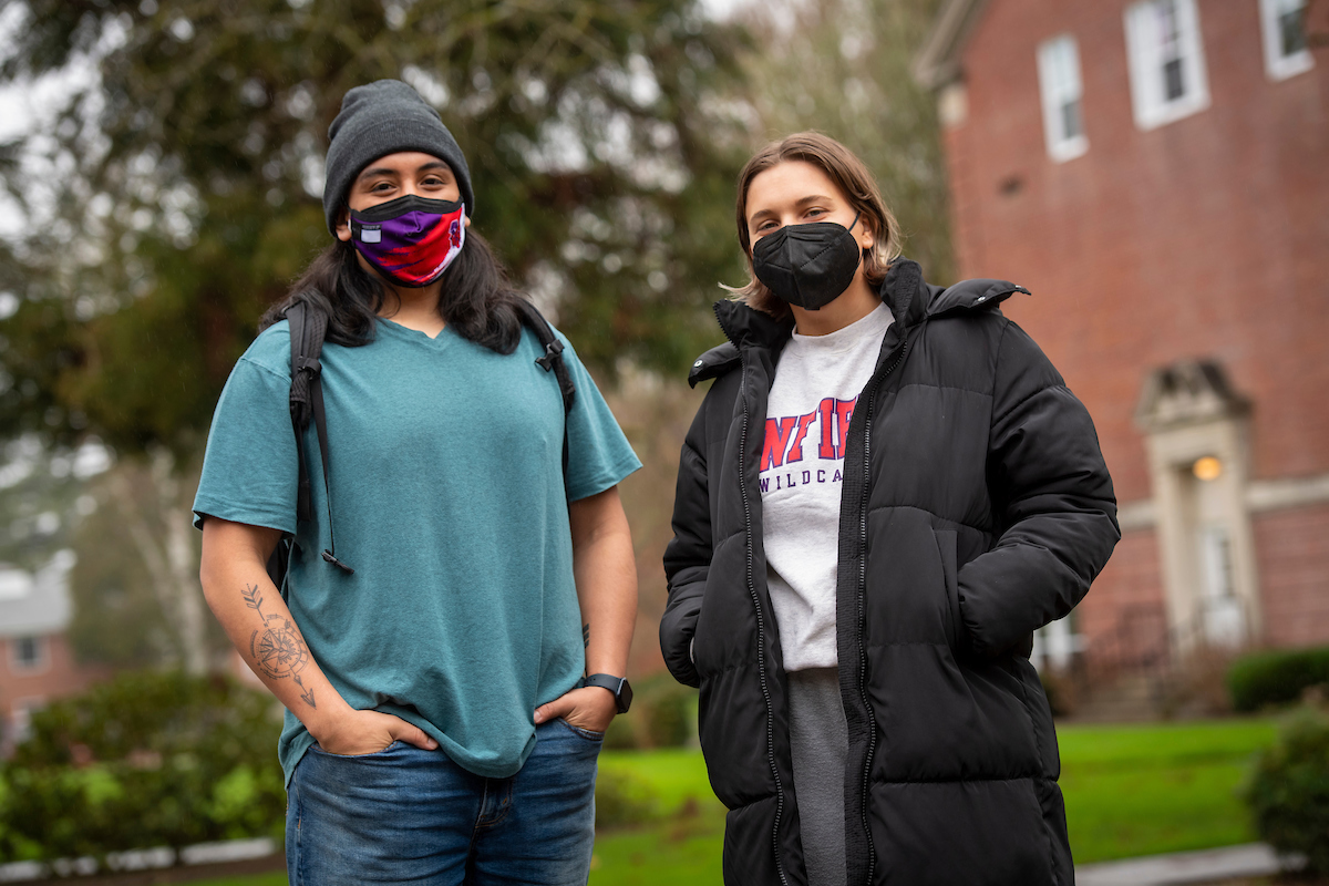 Two students wear KN95 masks on campus