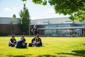 Nursing students sit outside on Portland campus