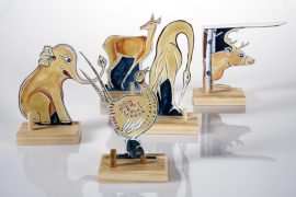 Woodwork from artist Belle Bezdicek of animal figurines painted in a folkloric style.