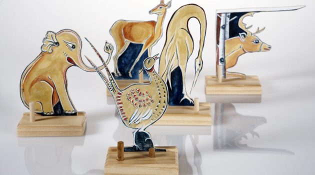 Woodwork from artist Belle Bezdicek of animal figurines painted in a folkloric style.