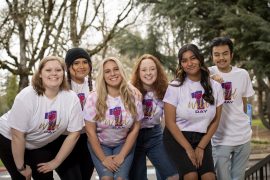 A group of Linfield students wear 'One Wild Day' t-shirts.