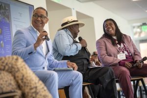 Marcus Johnson, Mac McDonald and Fern Stroud participate in a panel discussion.