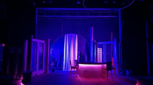 The set of Hurricane Diane, lit in blue and pink light.