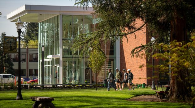 Students walk by the W.M. Keck Science Complex.