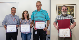 Staff award winners with certificates