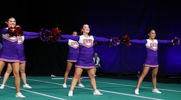 Linfield cheer team members perform at the 2024 UCA Cheerleading Nationals.