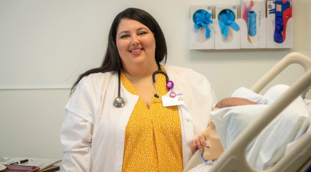 Kiki Fornero poses by a manikin