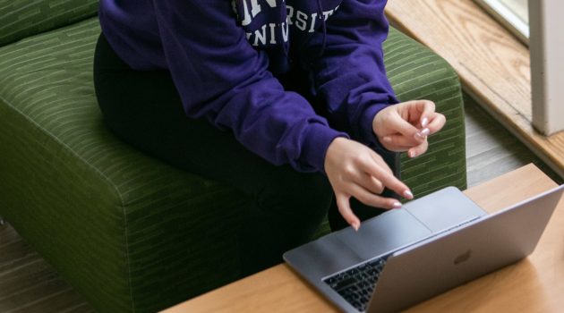 A student types on a laptop