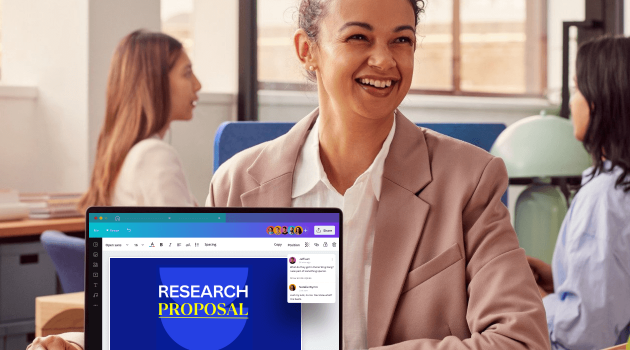 College student shows off computer with Canva Pro on screen