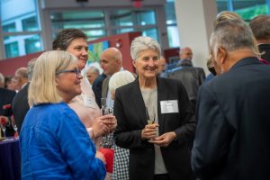 A group chats during the Celebrate Wonder dinner