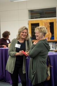 Two women chat during the Celebrate Wonder dinner