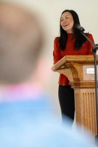 A speaker stands at a podium during Linfield University’s Asian American-Pacific Islander celebration.