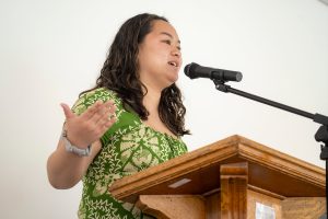 A speaker stands at a podium during Linfield University’s Asian American-Pacific Islander celebration.