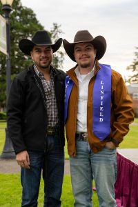 A family poses during the Linfield University Latine Dinner; the student wears a purple stole that says Linfield Latino.