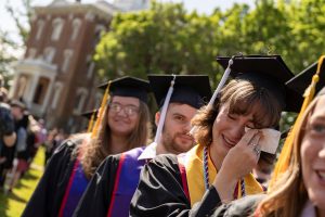 Students line up in their caps and gowns during the 2024 Linfield University Commencement.