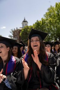 Students dressed in graduation caps and gowns celebrate during the 2024 Linfield University Commencement.