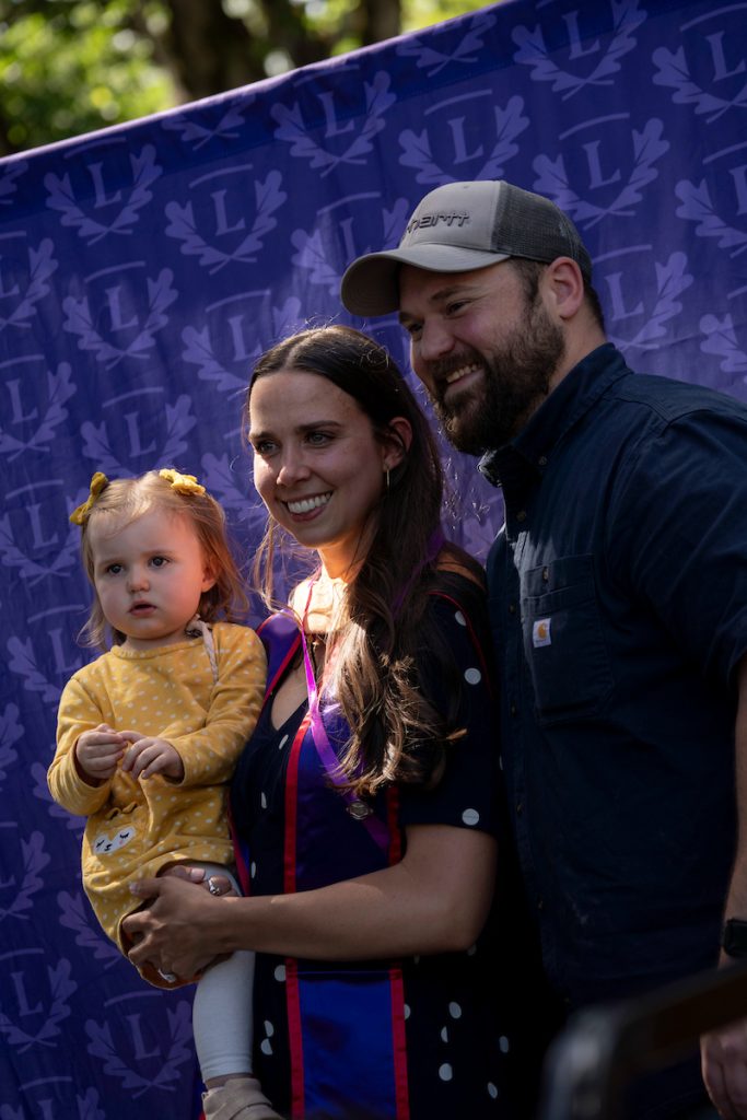 A family embraces during the Linfield University School of Nursing pinning ceremony.