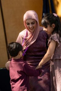 A family embraces during the Linfield University School of Nursing pinning ceremony.