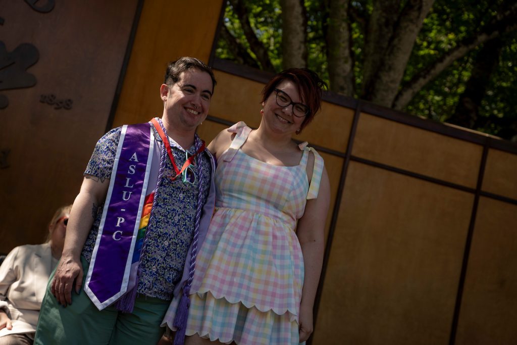 A family embraces during the Linfield University School of Nursing pinning ceremony.