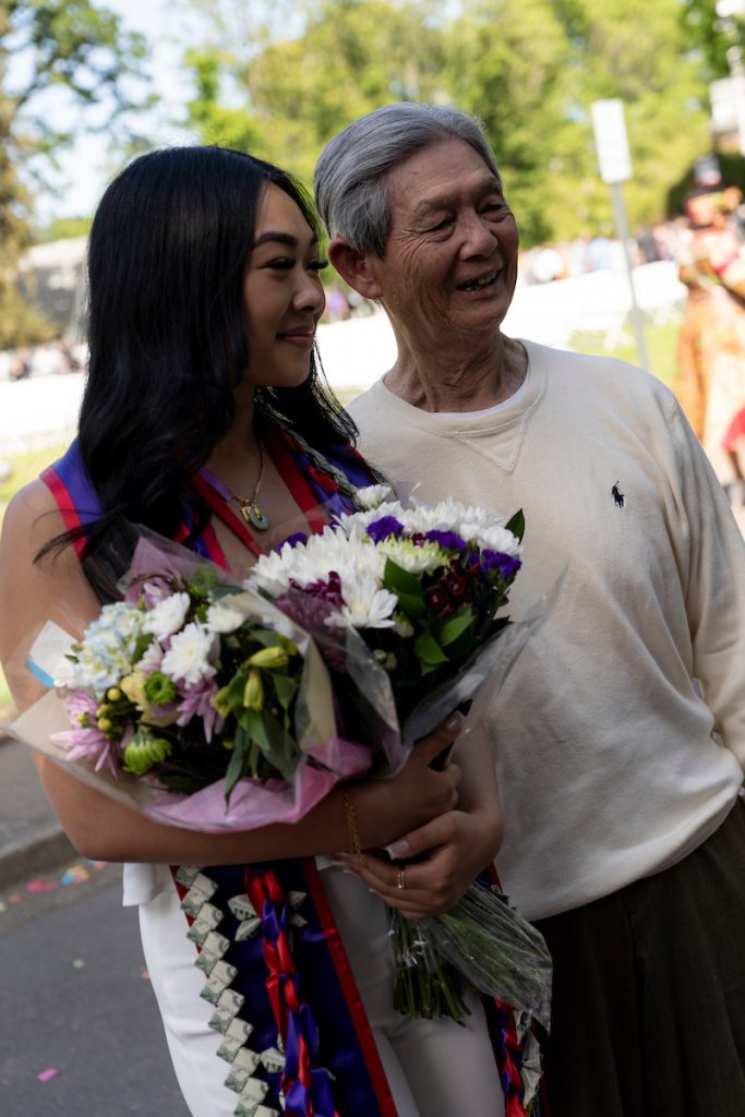 A family poses and smiles at the Linfield University School of Nursing 2024 Pinning Ceremony.