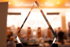 Close up of a Linfield Alumni award, a diamond-shaped clear etched-glass