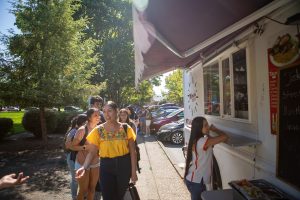 Students stand in line for a taco truck 