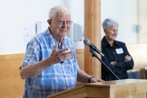 Trustee Dave Haugeberg speaks at the Loveridge Hall building dedication alongside Interim President Becky Johnson.
