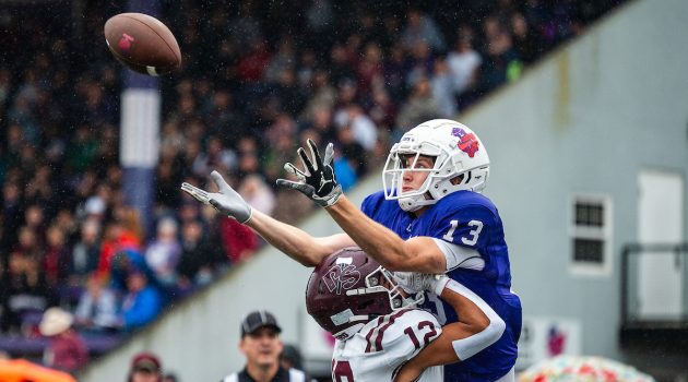 Football player catches a ball