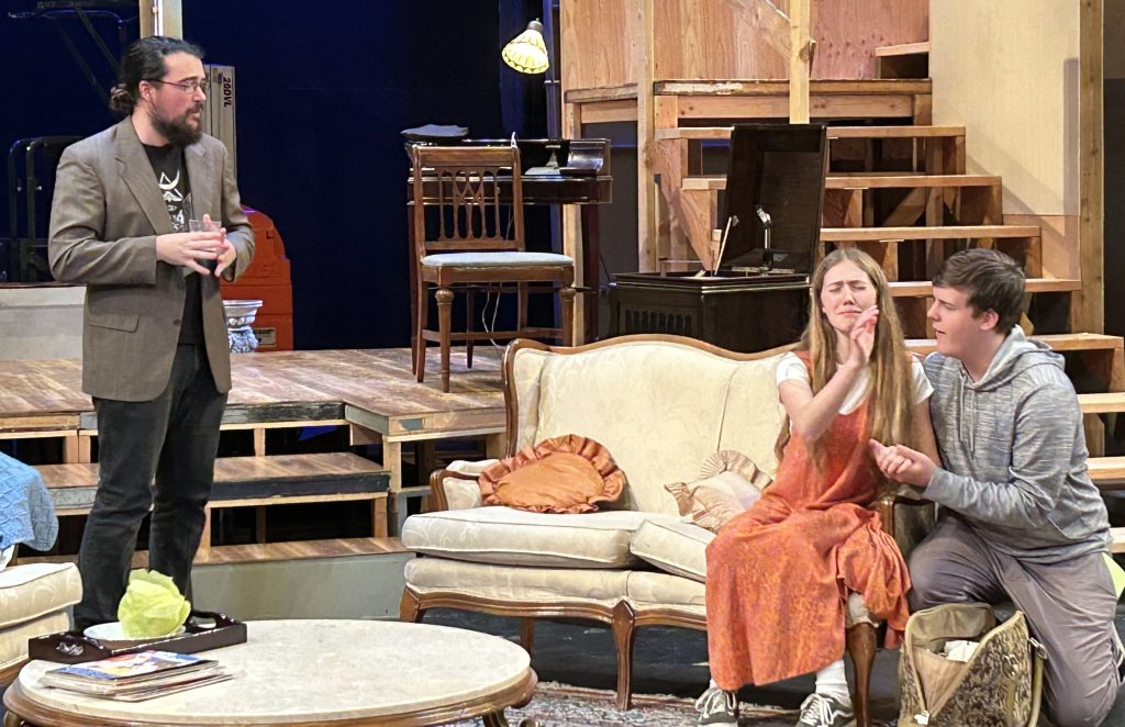 Students at a dress rehearsal for Death by Design