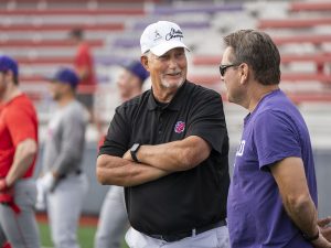 Linfield coaches chatting during during Linfield Homecoming 2024