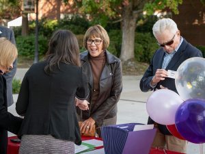 People greeting one another during Linfield Homecoming 2024