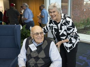 Two people smiling for a photo during Linfield Homecoming 2024