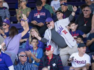 Fans cheering for Linfield during the football game at Linfield Homecoming 2024