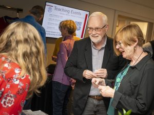 People talking during an event at Linfield Homecoming 2024
