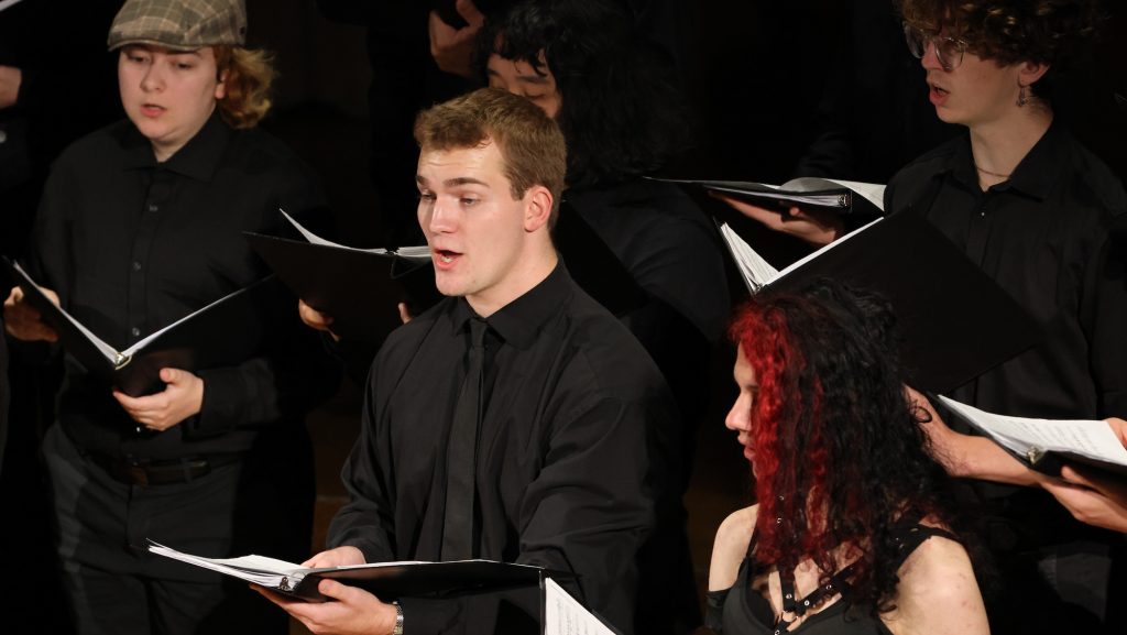 Members of the Concert Choir sing during a performance