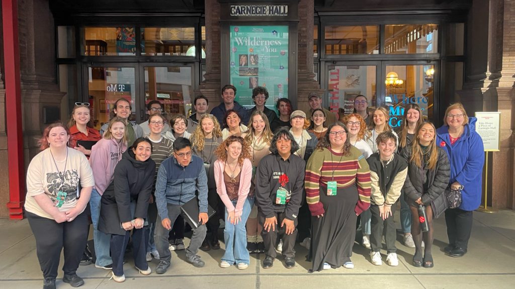 The Linfield Concert Choir poses as a group outside Carnegie Hall. 
