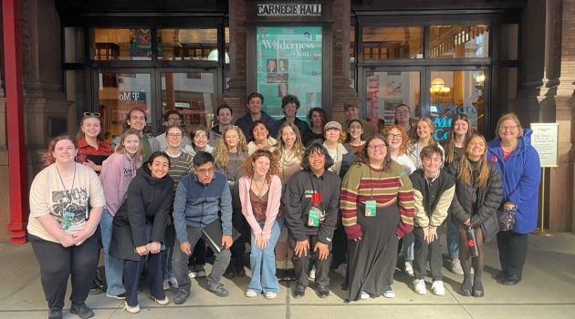 Members of the Linfield Concert Choir and director Julie Cross pose outside Carnegie Hall.