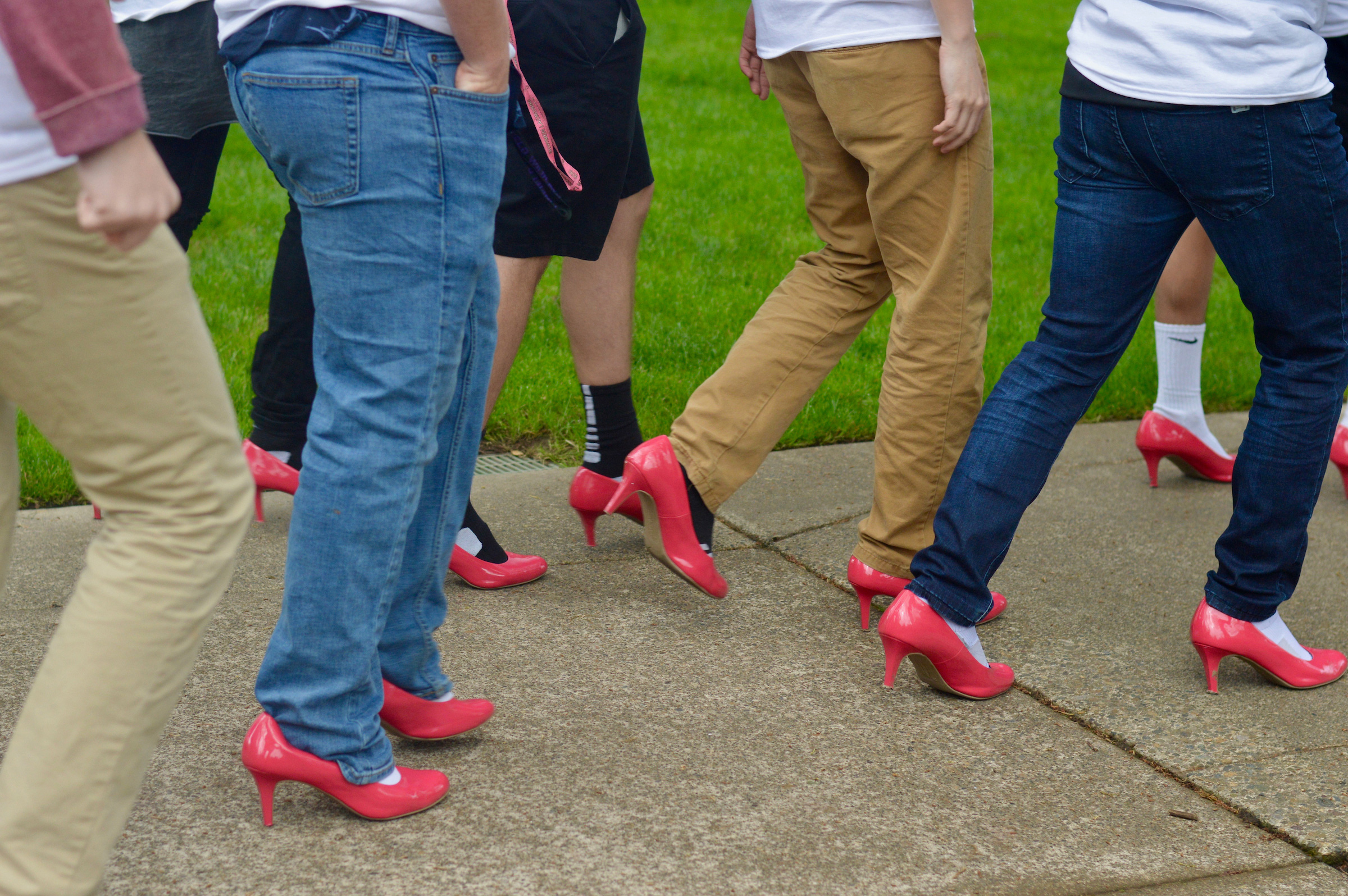 close up of Pike fraternity members wearing red high heels