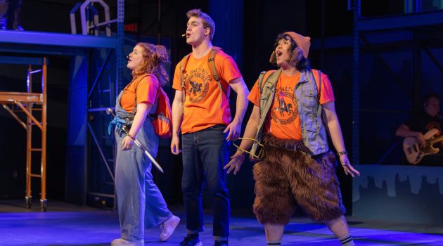 Three members of "The Lightning Thief: A Percy Jackson Musical" sing on stage.