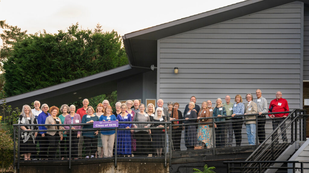 The class of 1975 stand outside Michelbook Country Club